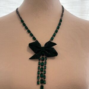 Betsy Johnson emerald green statement necklace with rhinestone bow.